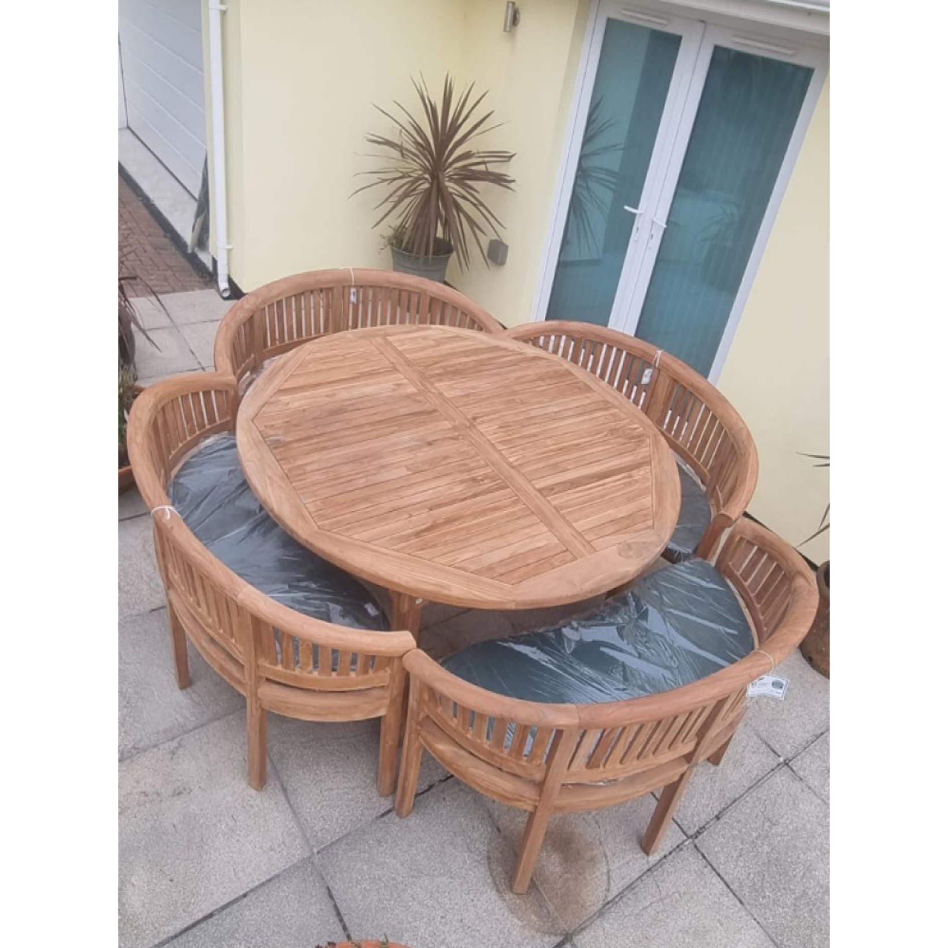 Teak garden dining set. 1.8m “Titan” round table, 4 bowwood style seats