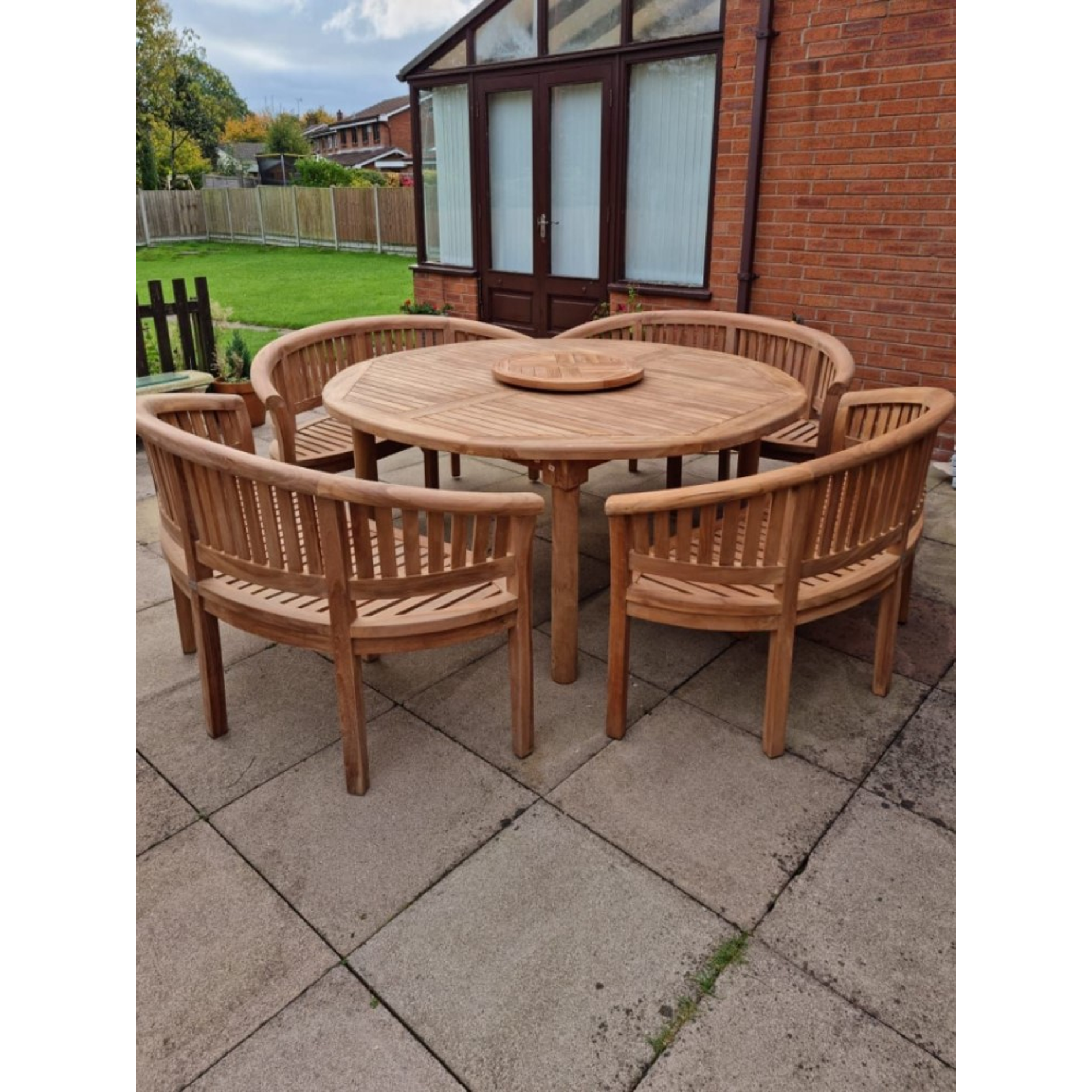 Teak garden dining set. 1.8m “Titan” round table, 4 bowwood style seats